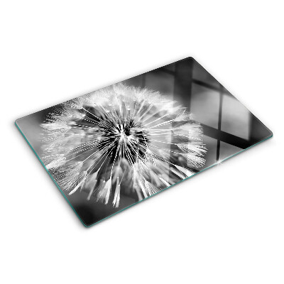 Glas-Schneidebrett mit schwarzweißem Löwenzahnmotiv