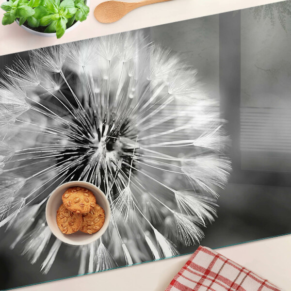 Glas-Schneidebrett mit schwarzweißem Löwenzahnmotiv