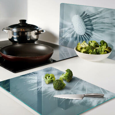 Glas-Schneidebrett mit Motiv Löwenzahn vor dem Himmel