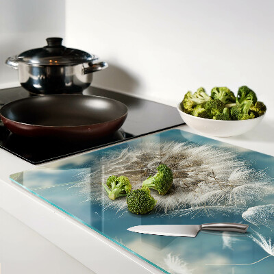 Glas-Schneidebrett mit Motiv eines Löwenzahns vor dem Himmel