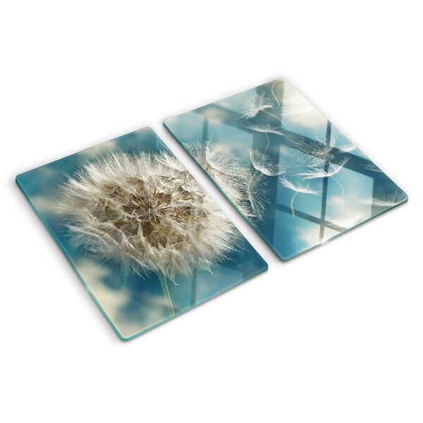 Glas schneidebrett Löwenzahn vor dem Himmel