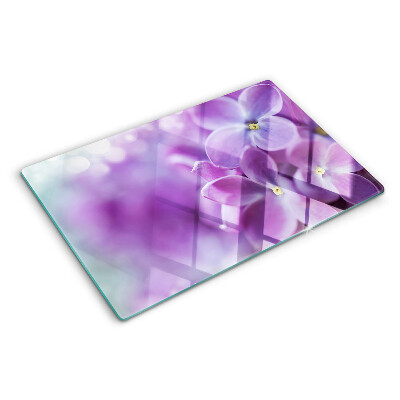 Schneidebrett Glas mit Blumen in Lilatönen