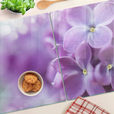 Schneidebrett Glas mit Blumen in Lilatönen