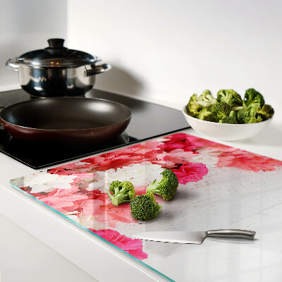 Glas-Schneidebrett mit Blumen in Rosa- und Weißtönen