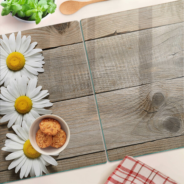 Schneidebrett mit Blumenmotiv auf Holzgrund