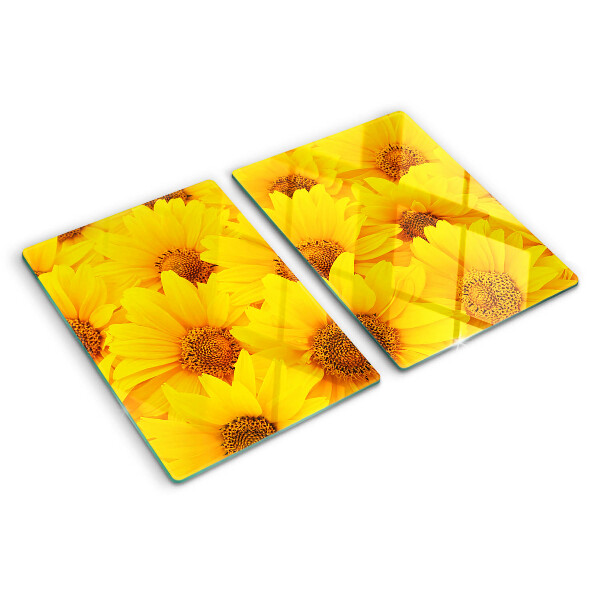 Schneidebrett Glas mit Sonnenblumen vor gelbem Hintergrund