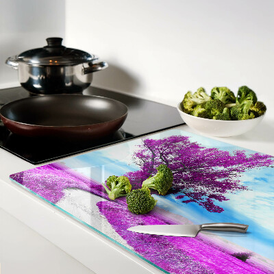 Schneidebrett Ein violetter Baum vor dem Himmel