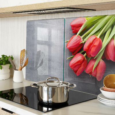 Glas schneidebrett Tulpen auf grauem Hintergrund