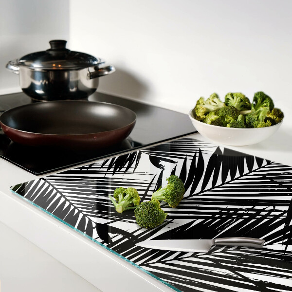 Schneidebrett Glas mit schwarzem und weißem Palmenblattmotiv