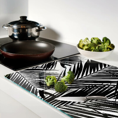 Schneidebrett Glas mit schwarzem und weißem Palmenblattmotiv