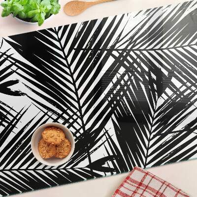 Schneidebrett Glas mit schwarzem und weißem Palmenblattmotiv