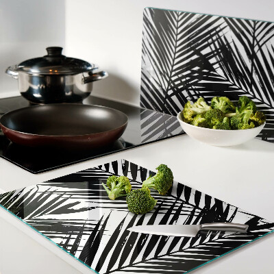 Schneidebrett Glas mit schwarzem und weißem Palmenblattmotiv