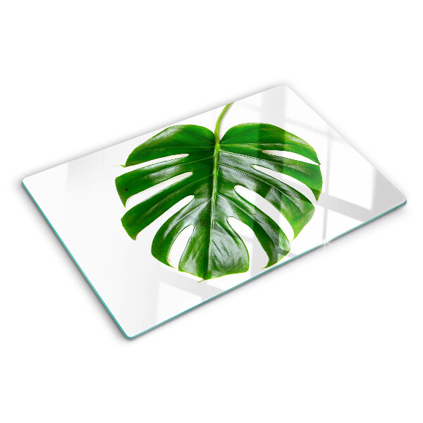 Glas Schneidebrett mit Monstera-Blättern