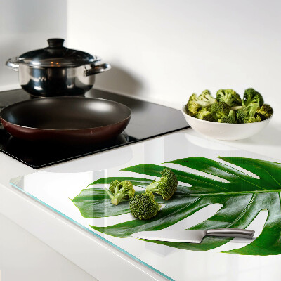 Glas Schneidebrett mit Monstera-Blättern