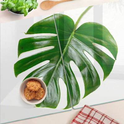 Glas Schneidebrett mit Monstera-Blättern