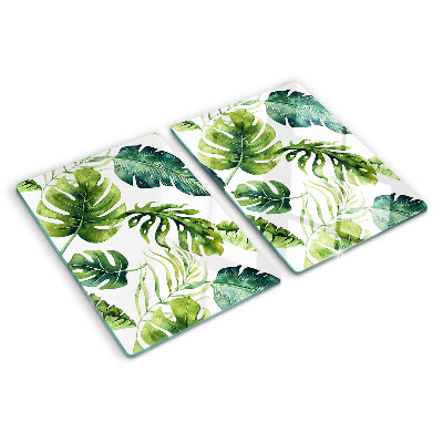 Schneidebrett mit Monstera‑Blättern in Grüntönen