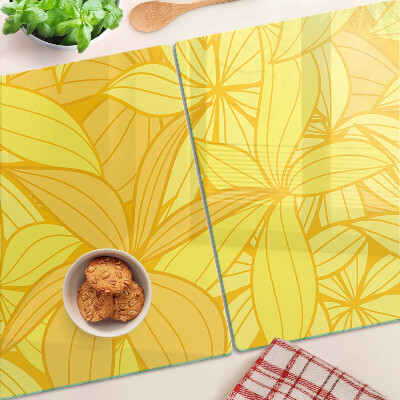 Glas-Schneidebrett mit gelbem tropischem Blattmotiv