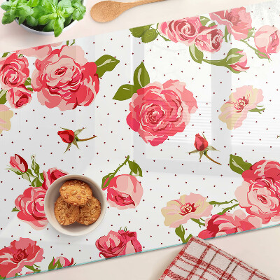 Glas-Schneidebrett mit Rosendekor auf weißem Hintergrund