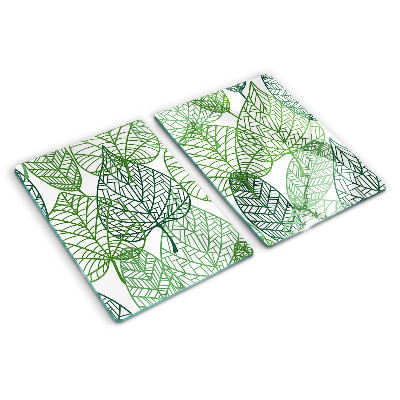 Glas-Schneidebrett mit Blättern in verschiedenen Grüntönen