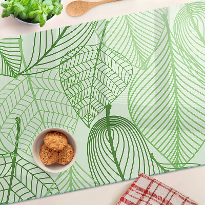 Glas-Schneidebrett mit Blättern in Grüntönen