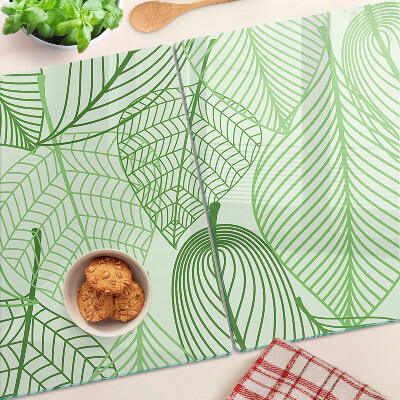 Glas-Schneidebrett mit Blättern in Grüntönen