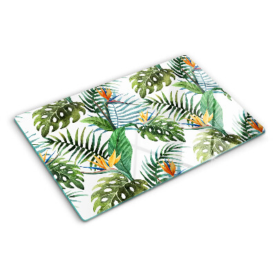 Schneidebrett Glas mit tropischen Blättern und Blüten als Dekor