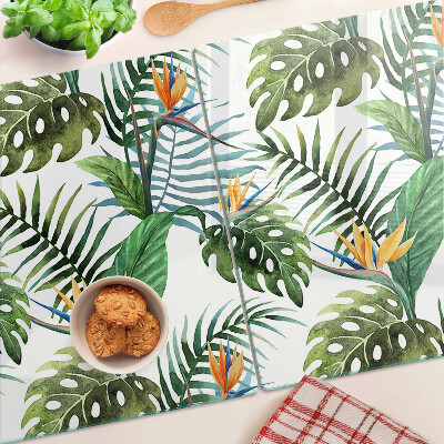 Schneidebrett Glas mit tropischen Blättern und Blüten als Dekor