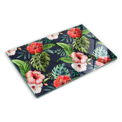 Glas-Schneidebrett mit tropischen Blumen und Blättern