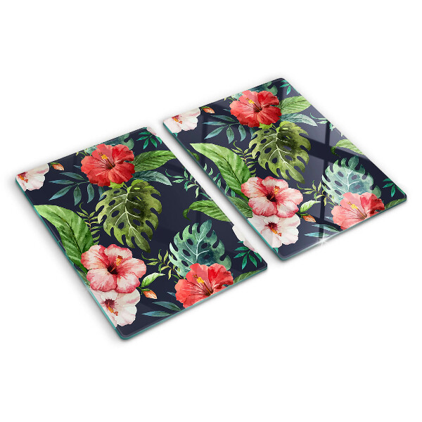 Glas-Schneidebrett mit tropischen Blumen und Blättern