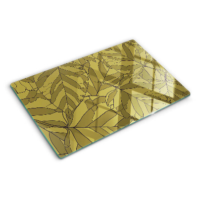 Schneidebrett mit Blattmotiv in Goldtönen