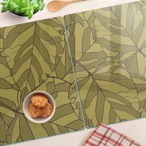 Schneidebrett mit Blattmotiv in Goldtönen