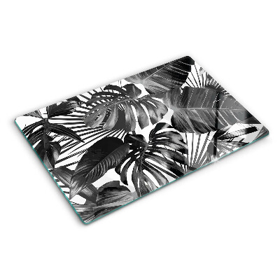Glas-Schneidebrett mit tropischen Blättern in Schwarzweiß