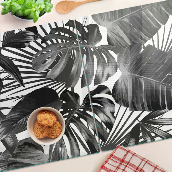 Glas-Schneidebrett mit tropischen Blättern in Schwarzweiß