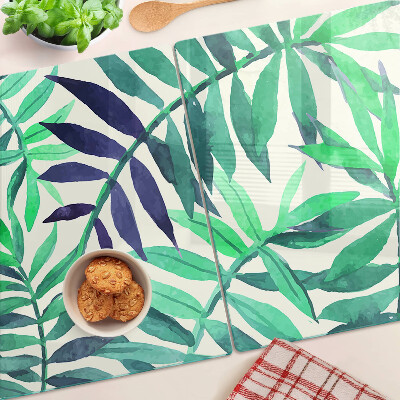 Glas-Schneidebrett mit Palmenblättern im Aquarellstil