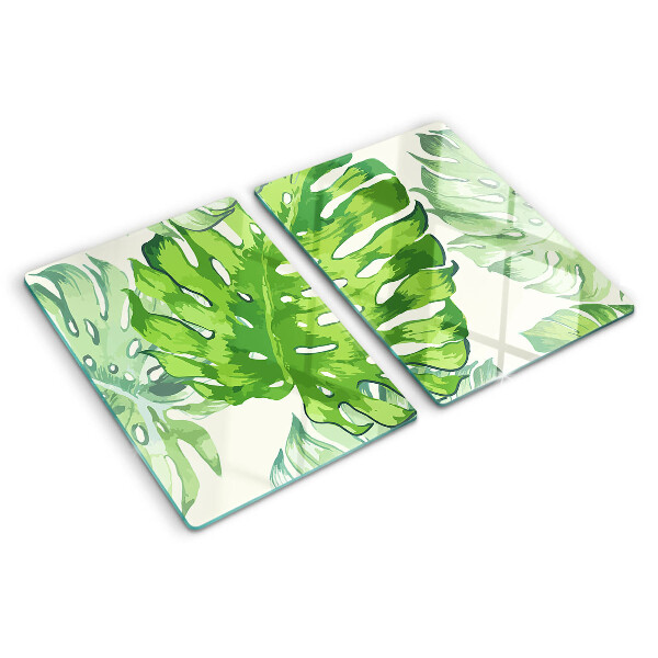 Schneidebrett Monstera-Blätter auf hellem Hintergrund