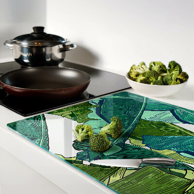 Glas-Schneidebrett mit Motiv aus Palmenblättern in Grüntönen
