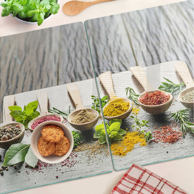 Glas-Schneidebrett mit Motiv aus Gewürzen und Kräutern