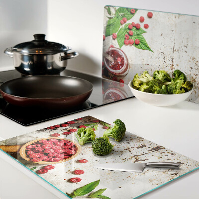 Glas schneidebrett Himbeeren und Blätter