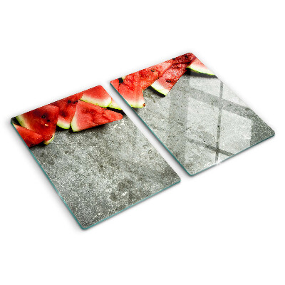 Schneidebrett mit Motiv von Wassermelonenscheiben auf grauem Hintergrund