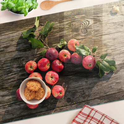 Glas schneidebrett Äpfel auf Holzgrund