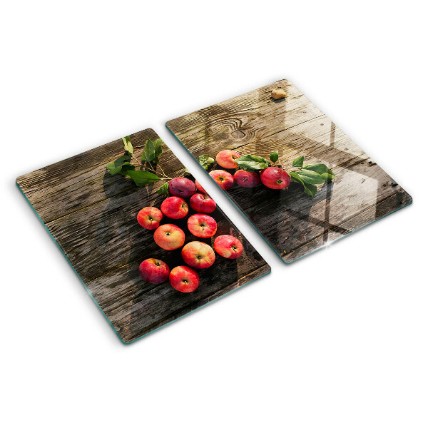 Glas-Schneidebrett mit Motiv von Äpfeln auf Holzgrund