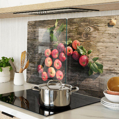 Glas-Schneidebrett mit Motiv von Äpfeln auf Holzgrund