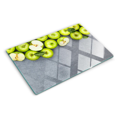 Schneidebrett mit Motiv grüne Äpfel auf grauem Untergrund