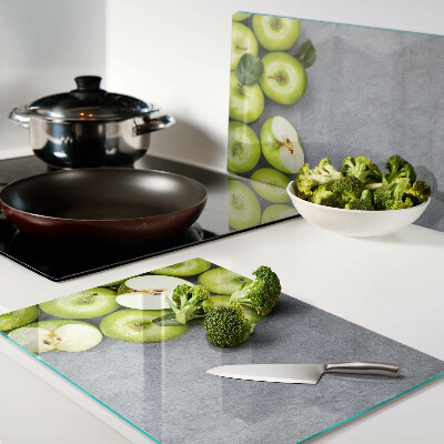 Schneidebrett mit Motiv grüne Äpfel auf grauem Untergrund