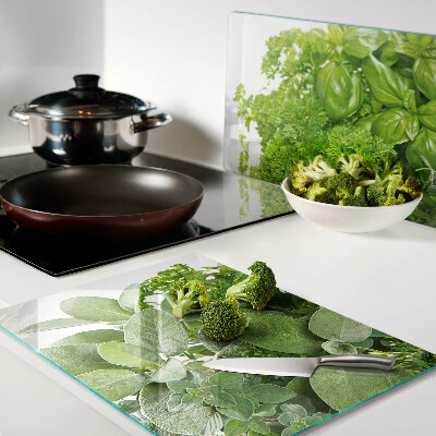 Glas-Schneidebrett mit grünem Kräuter- und Blättermotiv