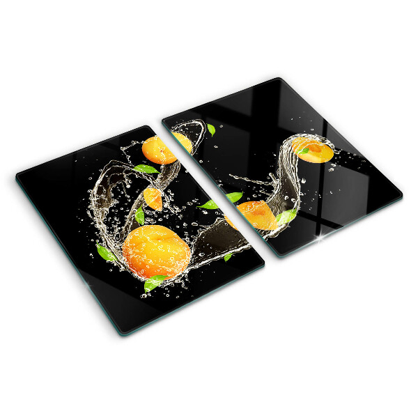 Glas-Schneidebrett mit Motiv aus Zitrusfrüchten im Wasser