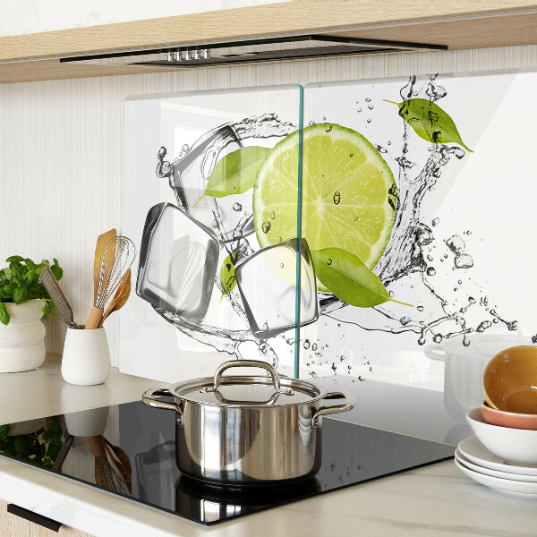 Glas-Schneidebrett mit Motiv einer Zitrone auf Eis und Blättern