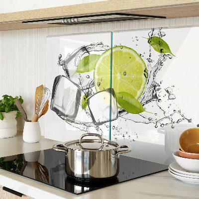 Glas-Schneidebrett mit Motiv einer Zitrone auf Eis und Blättern