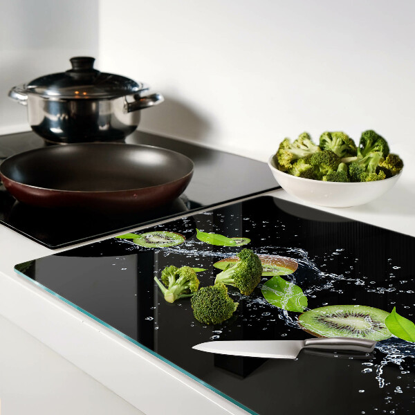 Schneidebrett mit Motiv einer Kiwi im Wasser und Blättern