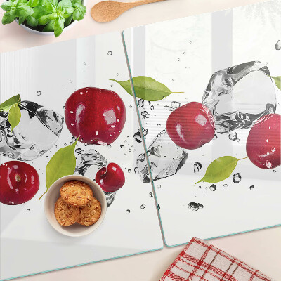 Schneidebrett mit Motiv roter Äpfel und Eiskristallen